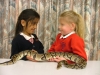 Two girls holding royal python